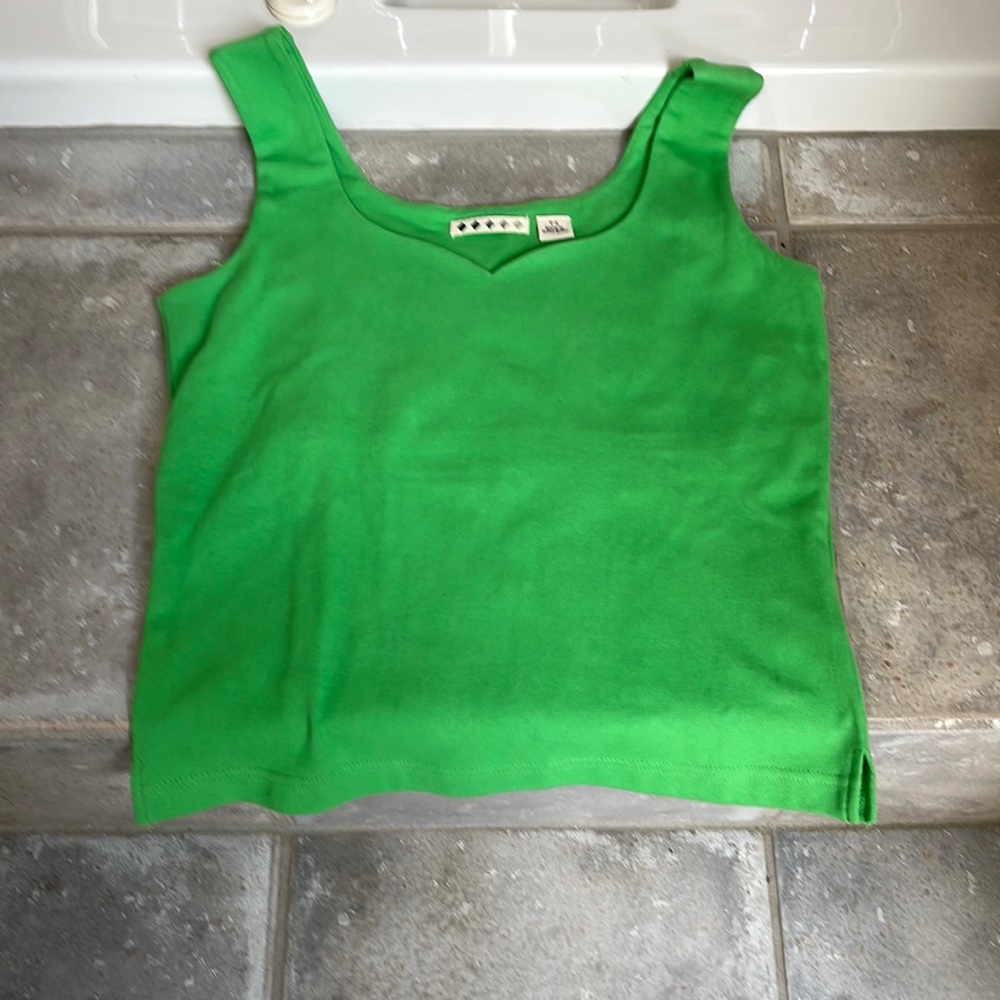 Women’s tank top with sweet heart neck. New with tags. Size small petite.